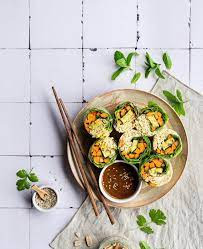 Food art done in a white plate with two chopsticks on side